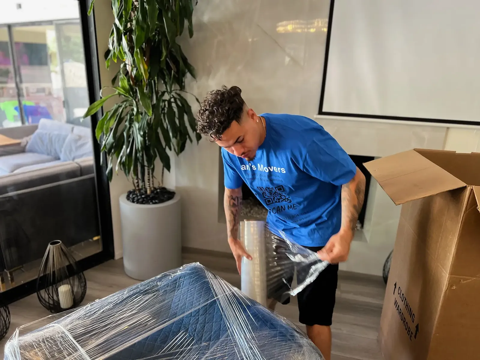 Ian's Movers crew wrapping furniture for protection